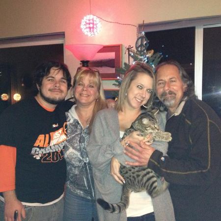 Barry Sless with his wife and two kids.